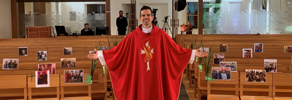Fr Dan in the Church with empty pews