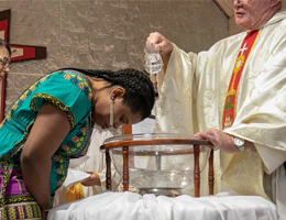 Adult woman being baptised